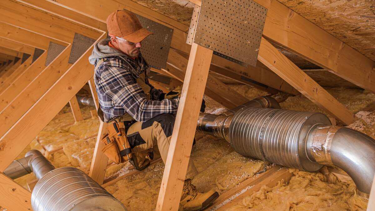 top insulation options to maximize cost savings - contractor installs insulation in home attic - All Pros Property Services